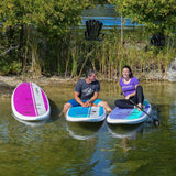 man and woman relaxing on a Cruiser SUP® stand up paddle board on a lake