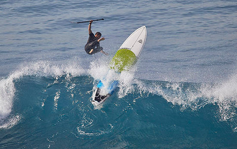 A stand up paddle boarding wipeout