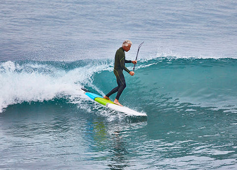 a goofy footed stand up paddle boarder