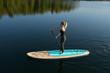 woman stand up paddle boarding on Cruiser SUP® Xplorer SE on a lake