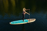 woman stand up paddle boarding on Cruiser SUP® Xplorer SE on a lake