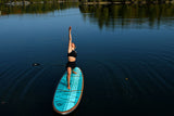 woman doing yoga on a Cruiser SUP® stand up paddle board - Xpedition Woody