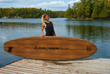 woman carrying a Cruiser SUP® stand up paddle board - Xpedition Woody