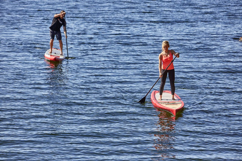 Inflatable Paddle Board beside a Non Inflatable Paddle Board