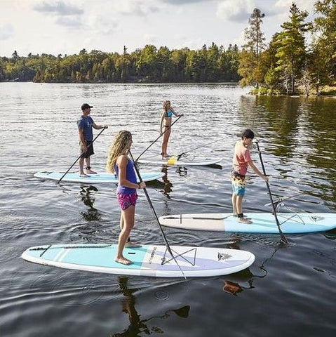 A family stand up paddle boarding on hard stand up paddle boards