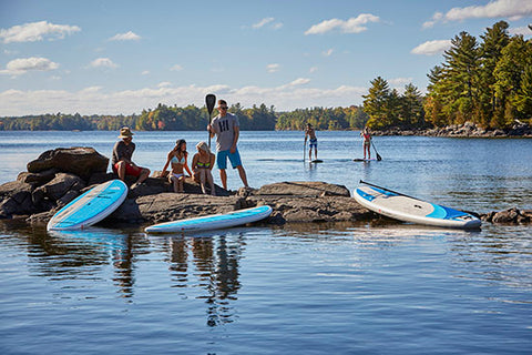 Stand up paddle boarders taking a break