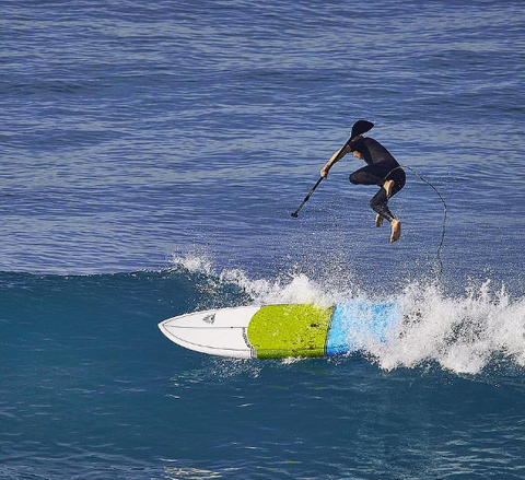 Stand Up Paddle Boarder Wearing a SUP Leash and Falling into the Water