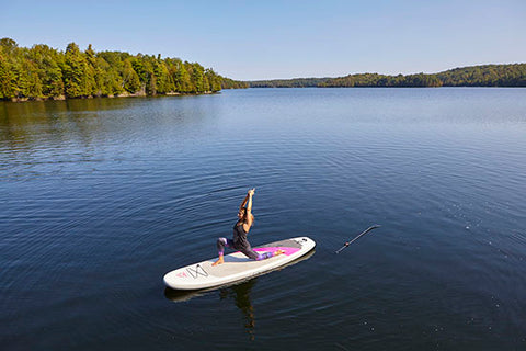 Doing SUP yoga on a stand up paddle board